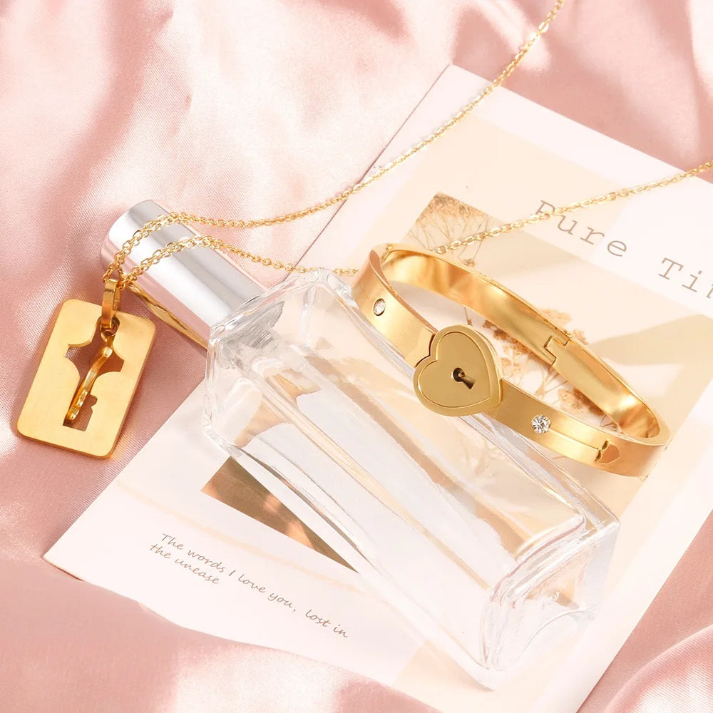 Stainless Steel Couples Lock Bracelet & Key Necklace Set.