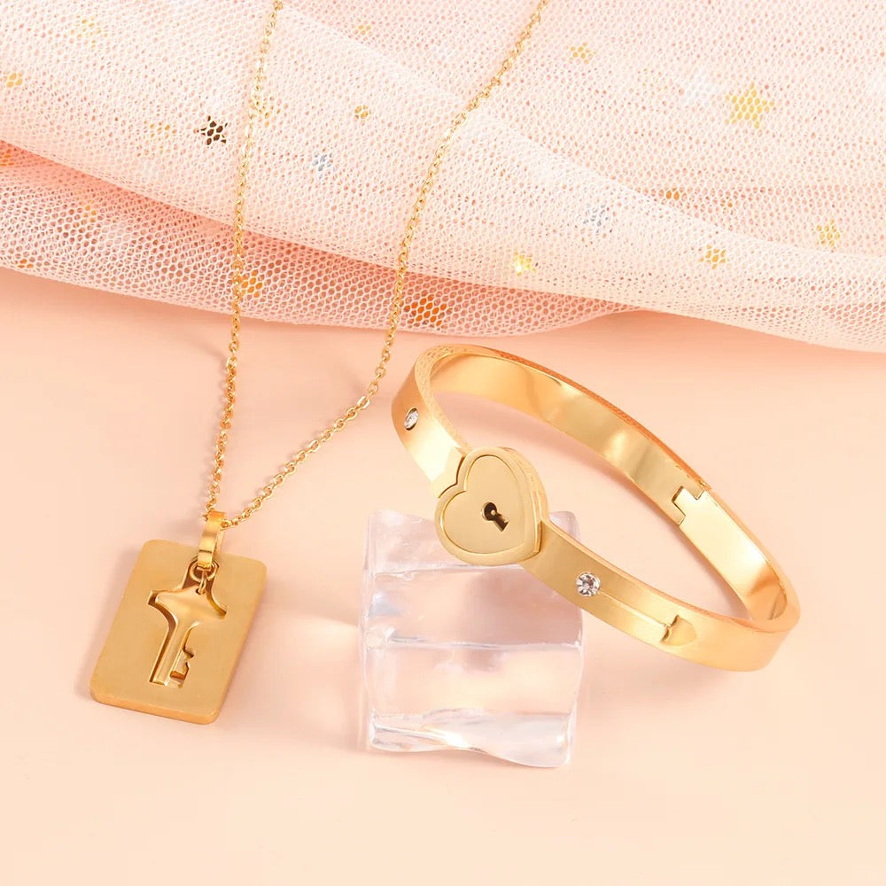 Stainless Steel Couples Lock Bracelet & Key Necklace Set.