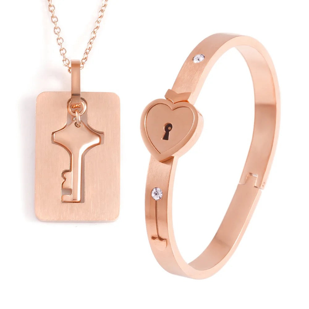 Stainless Steel Couples Lock Bracelet & Key Necklace Set.