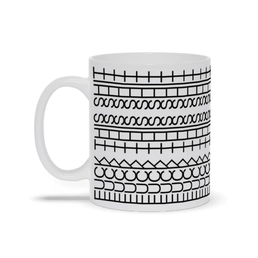 Ceramic humour mug shown held in a hand